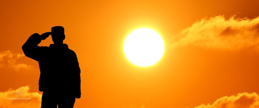 A veteran saluting at sunrise