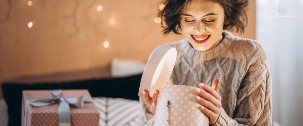 Woman Opening a GiftECG